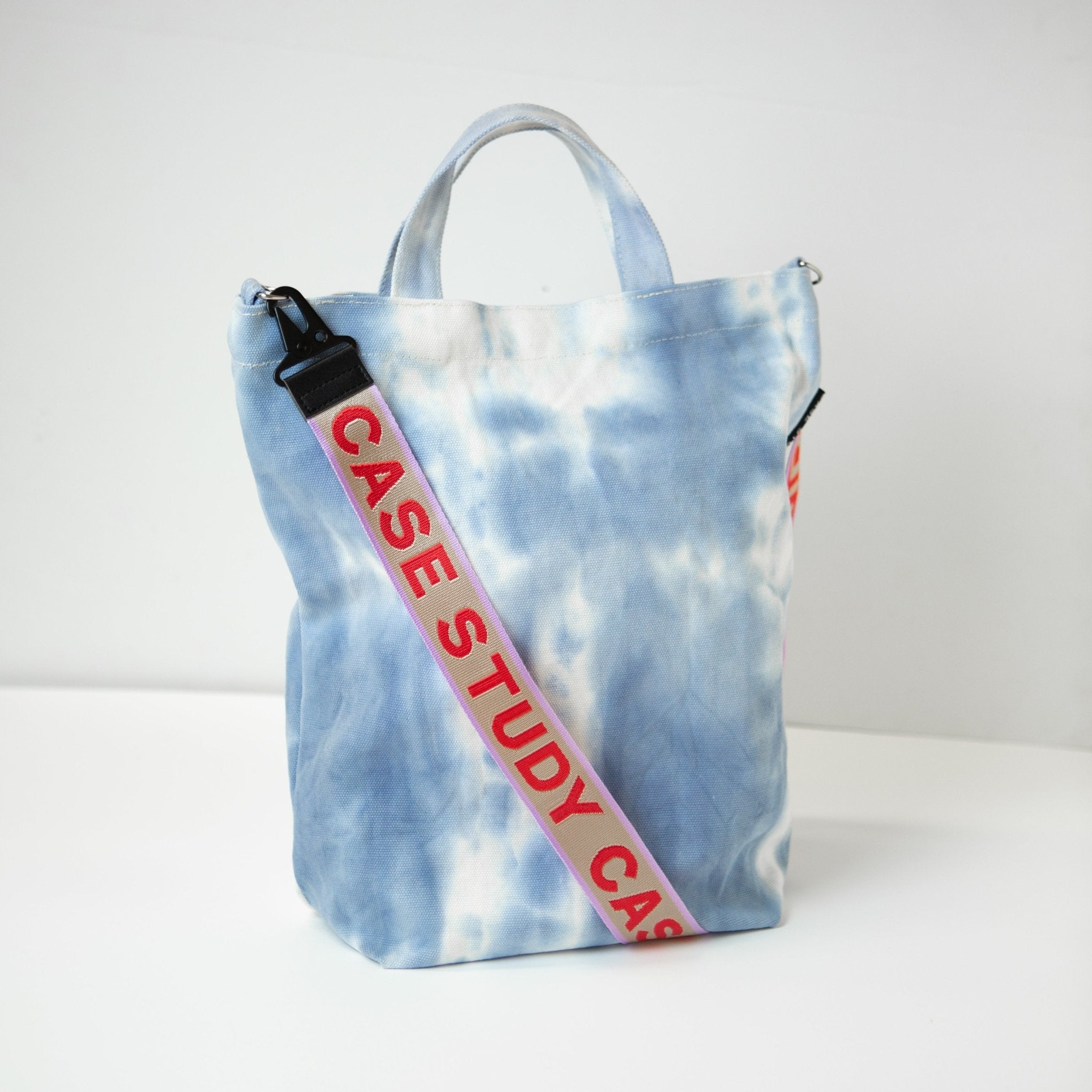 Dyed Tote + Stra tie dyed canvas tote in a pale blue and white color with a red and lavender Case Study crossbody strapap - Cornflower - Case Study